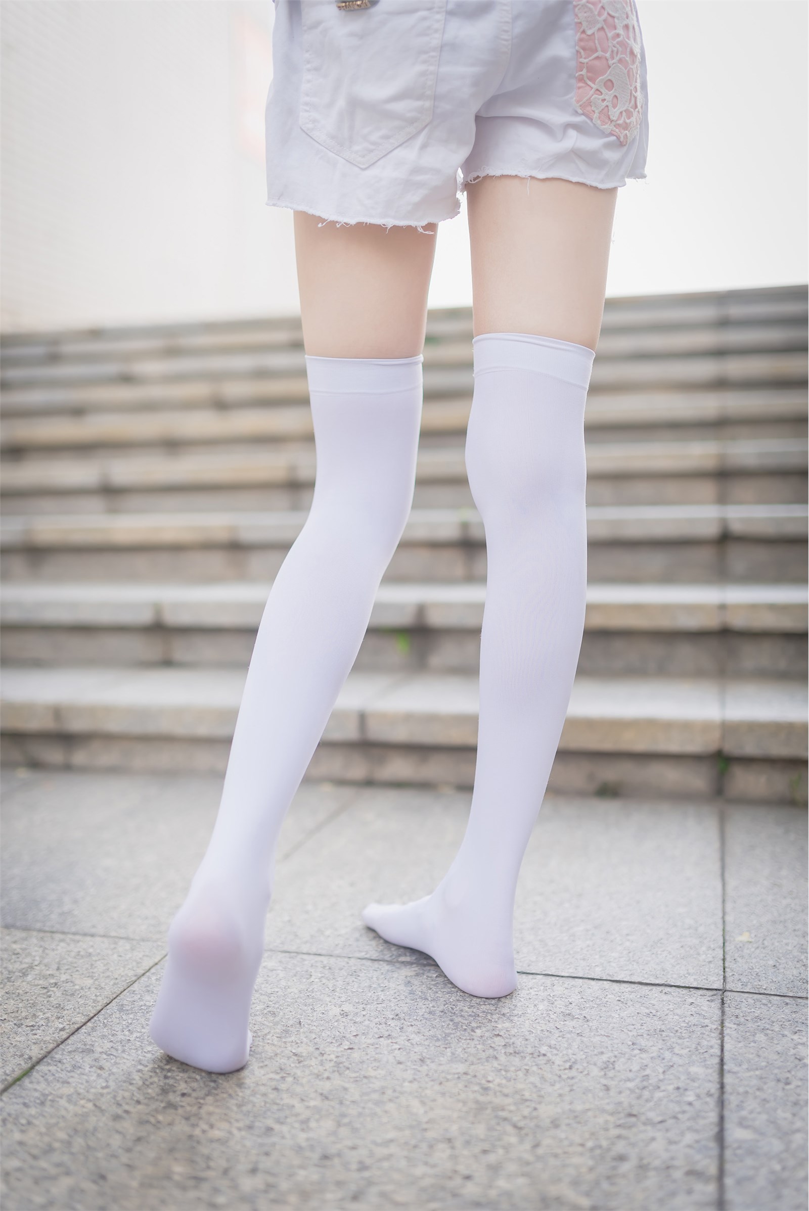 Rabbit plays with painted white stockings over the knee(37)